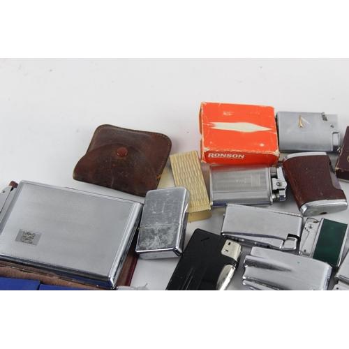 1122 - A large collection of vintage cigarette lighters to include Ronson etc.