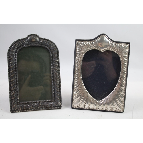 2454 - Two .925 sterling silver photograph frames - largest approx. 13.5cm wide x 19cm high