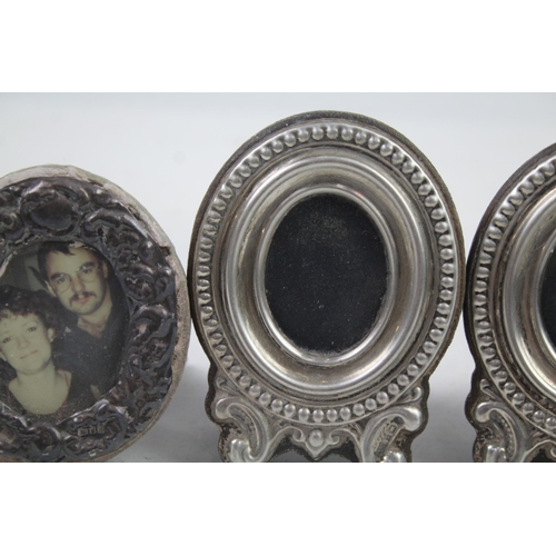 2454B - Four .925 sterling silver photograph frames - largest approx. 7cm wide x 9.5cm high