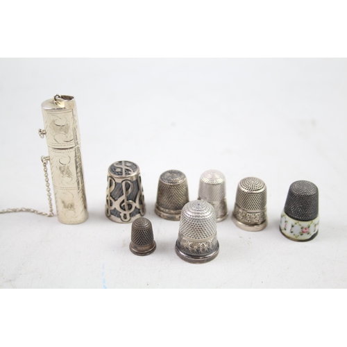 2454E - Eight pieces of .925 sterling silver, seven thimbles and one needle case - approx. gross weight 40g