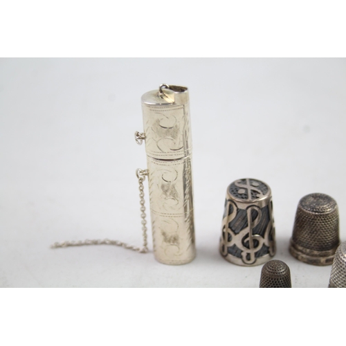 2454E - Eight pieces of .925 sterling silver, seven thimbles and one needle case - approx. gross weight 40g