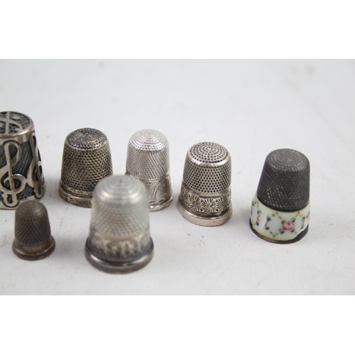 2454E - Eight pieces of .925 sterling silver, seven thimbles and one needle case - approx. gross weight 40g