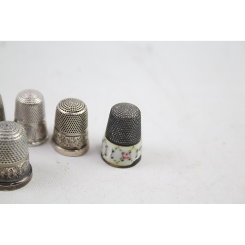 2454E - Eight pieces of .925 sterling silver, seven thimbles and one needle case - approx. gross weight 40g