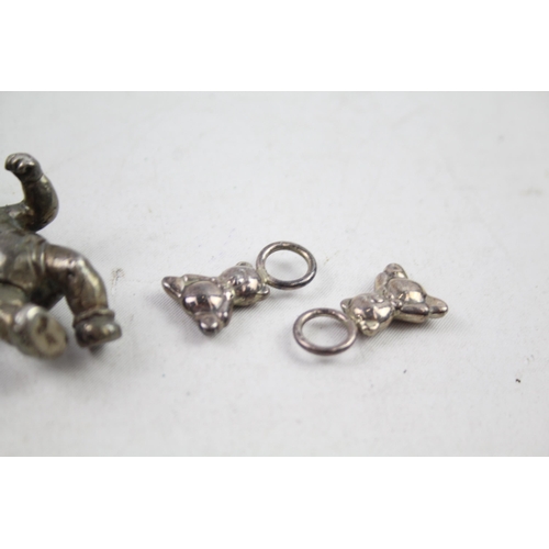 2454H - Four hallmarked sterling silver items to include baby rattles etc. - approx. gross weight 82g