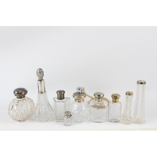 2468 - Nine .925 sterling silver topped and cut glass vanity bottles