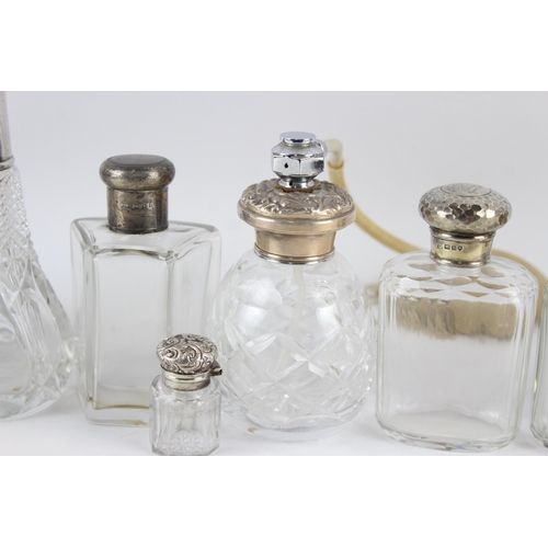 2468 - Nine .925 sterling silver topped and cut glass vanity bottles