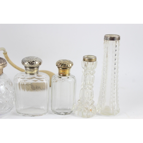 2468 - Nine .925 sterling silver topped and cut glass vanity bottles