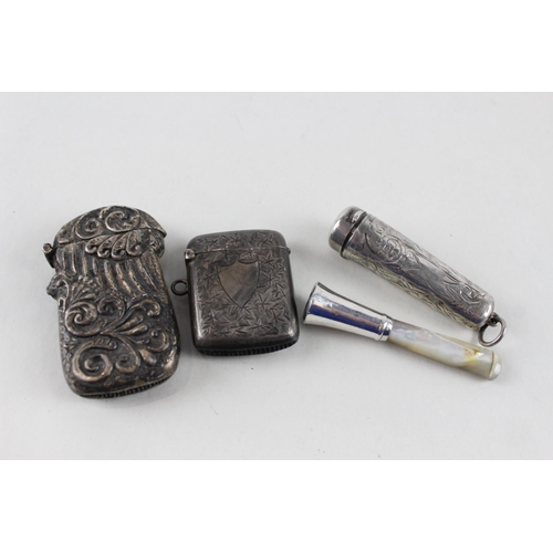 2471 - Four .925 sterling silver tobacciana items to include two vesta cases etc. - approx. gross weight 64... 