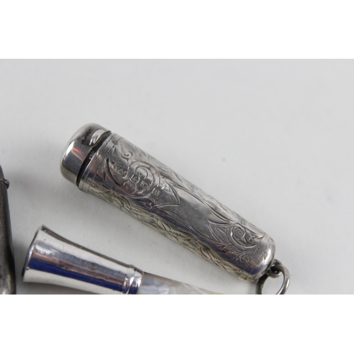 2471 - Four .925 sterling silver tobacciana items to include two vesta cases etc. - approx. gross weight 64... 