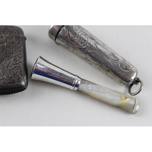 2471 - Four .925 sterling silver tobacciana items to include two vesta cases etc. - approx. gross weight 64... 