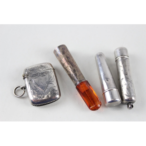 2476 - Four pieces of .925 silver tobacciana to include vesta case, two cheroot cases etc. - approx. gross ... 