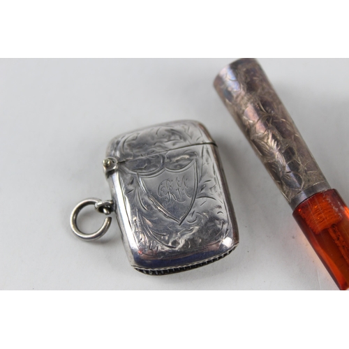 2476 - Four pieces of .925 silver tobacciana to include vesta case, two cheroot cases etc. - approx. gross ... 