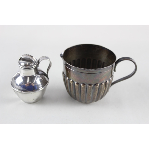 2484 - Two sterling silver cream jugs - approx. gross weight 76g