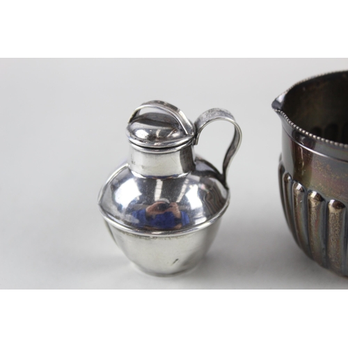 2484 - Two sterling silver cream jugs - approx. gross weight 76g