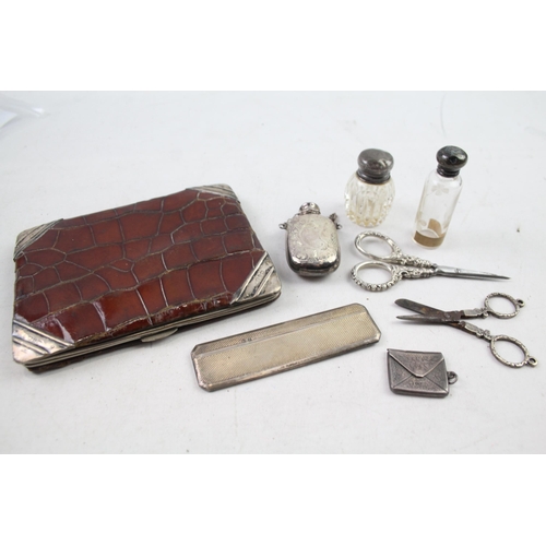 2486 - Eight .925 sterling silver vanity items to include scent bottles, purse etc.