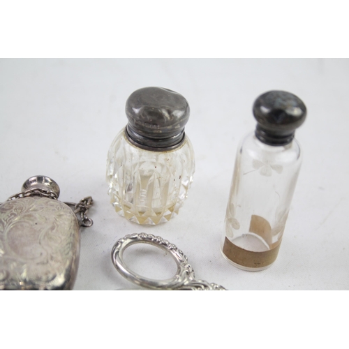 2486 - Eight .925 sterling silver vanity items to include scent bottles, purse etc.