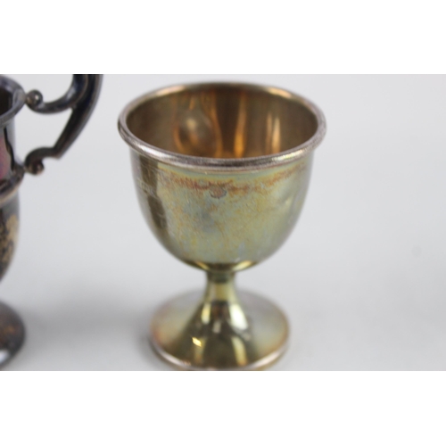 2487 - Two .925 sterling silver items, one trophy and one egg cup - approx. gross weight 54g