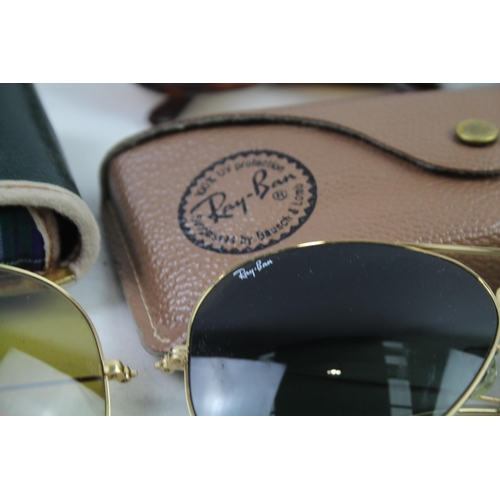 944 - Four cased pairs of Ray-Ban sunglasses