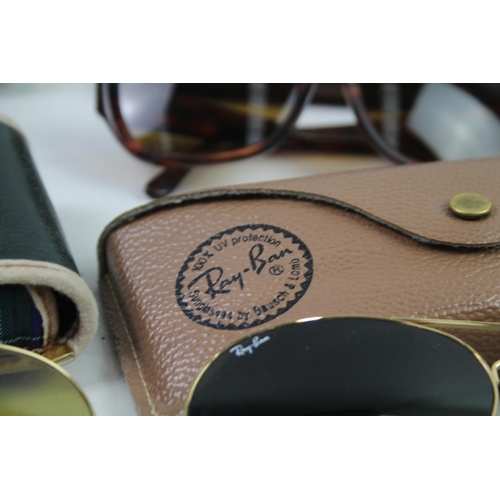 944 - Four cased pairs of Ray-Ban sunglasses