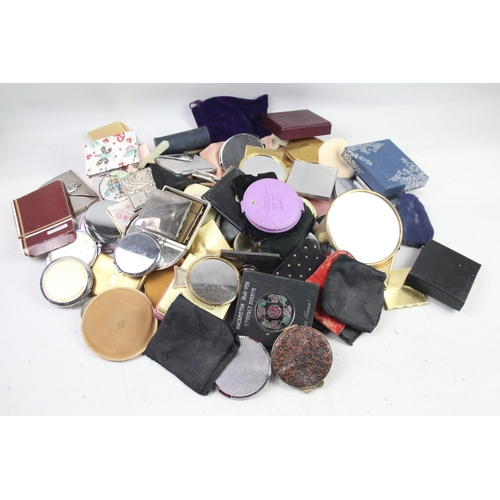 947 - A large collection of compact mirrors