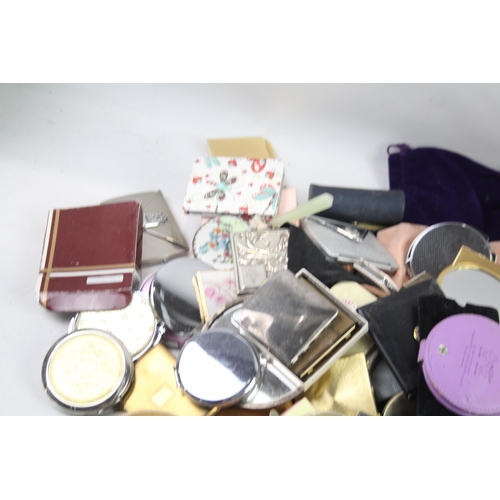 947 - A large collection of compact mirrors