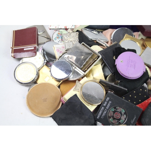 947 - A large collection of compact mirrors