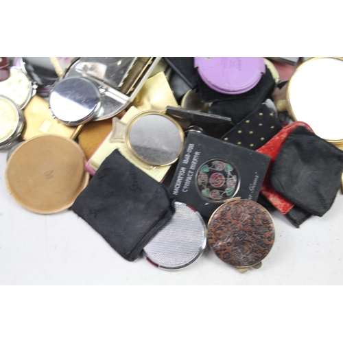 947 - A large collection of compact mirrors