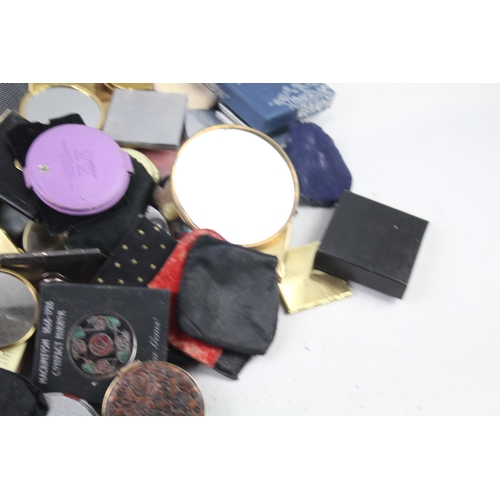 947 - A large collection of compact mirrors