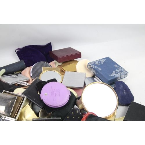 947 - A large collection of compact mirrors