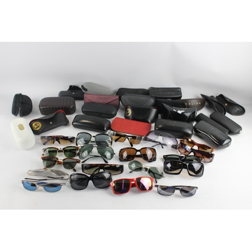 967 - A large collection of sunglasses and prescription glasses