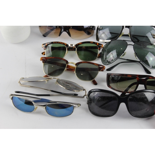 967 - A large collection of sunglasses and prescription glasses