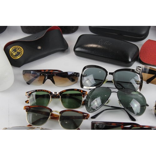 967 - A large collection of sunglasses and prescription glasses