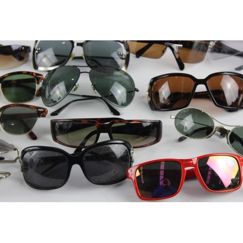 967 - A large collection of sunglasses and prescription glasses