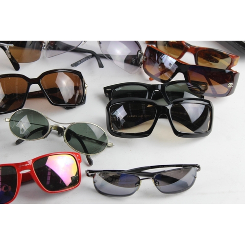 967 - A large collection of sunglasses and prescription glasses