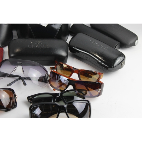 967 - A large collection of sunglasses and prescription glasses