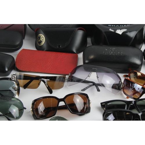 967 - A large collection of sunglasses and prescription glasses