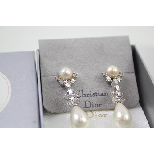 2346 - Two pairs of boxed Christian Dior earrings - approx. gross weight 25g