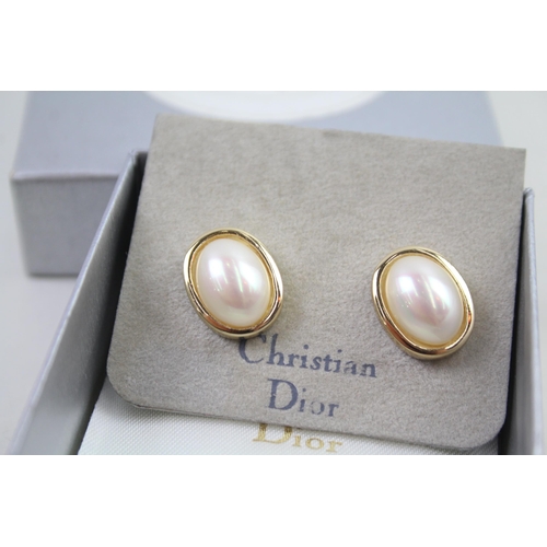 2346 - Two pairs of boxed Christian Dior earrings - approx. gross weight 25g