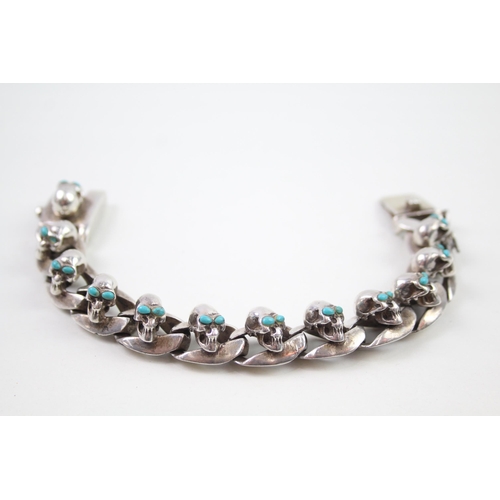 2353 - A silver skull design curb link bracelet - approx. gross weight 135g