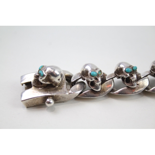 2353 - A silver skull design curb link bracelet - approx. gross weight 135g