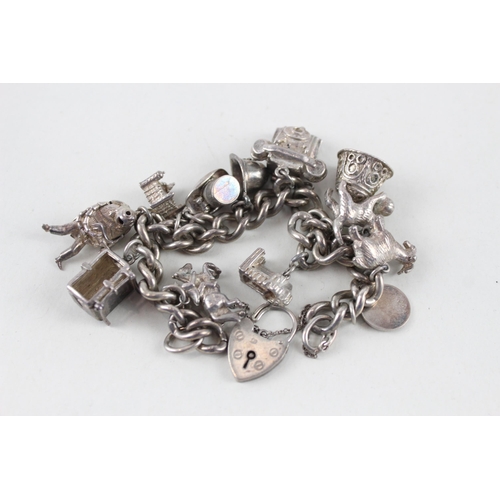 2389 - A silver charm bracelet with assorted animal charms - approx. gross weight 81g