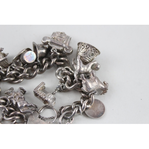 2389 - A silver charm bracelet with assorted animal charms - approx. gross weight 81g