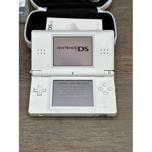 440 - A cased Nintendo DS Lite with games