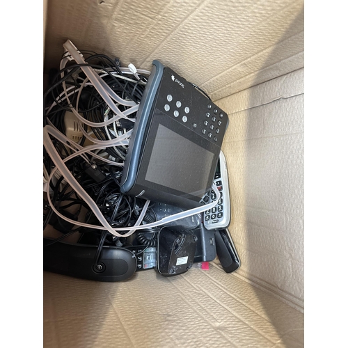 468 - A box containing various landline phones and WIFI routers