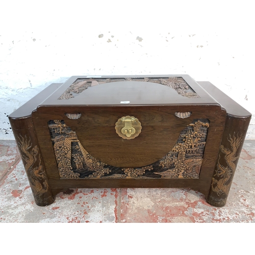 104 - A Chinese carved camphor wood blanket box - approx. 56cm high x 101cm wide x 56cm deep