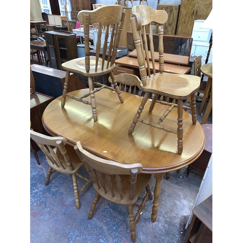 109 - A beech extending dining table and six chairs - approx. 76cm high x 110cm wide x 165cm long