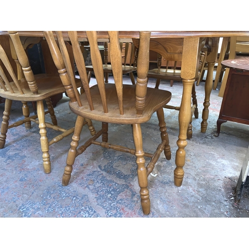 109 - A beech extending dining table and six chairs - approx. 76cm high x 110cm wide x 165cm long