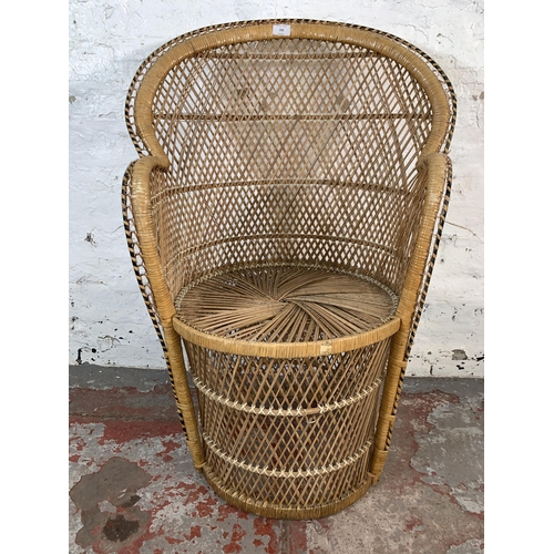 226 - A mid 20th century wicker peacock chair - approx. 94cm high x 65cm wide x 47cm deep