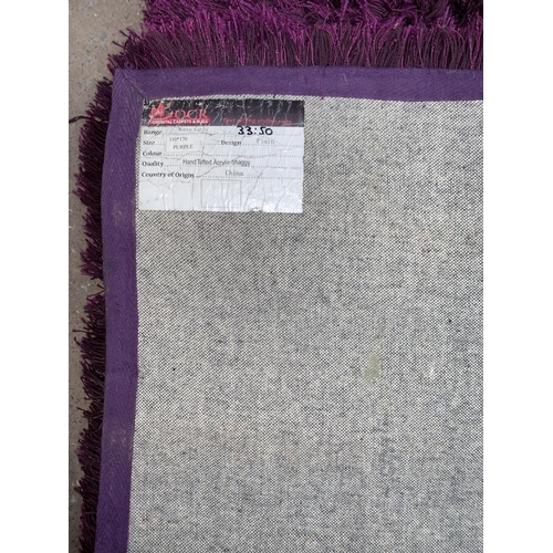 233 - An Oriental Carpets & Rugs Monte Carlo purple rug - approx. 170cm x 110cm