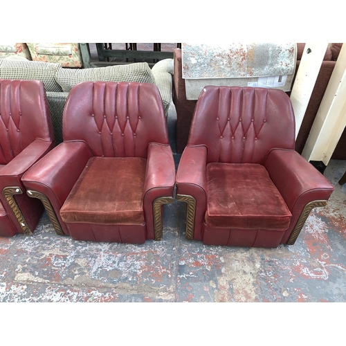 241 - An Art Deco red vinyl and carved wooden three piece lounge suite comprising two seater sofa and two ... 